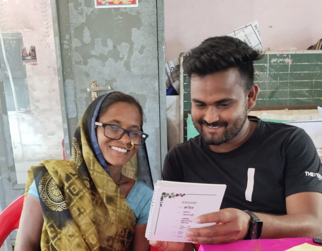 The Nudge Institute executive with the participant, helping her assess her eyesight.