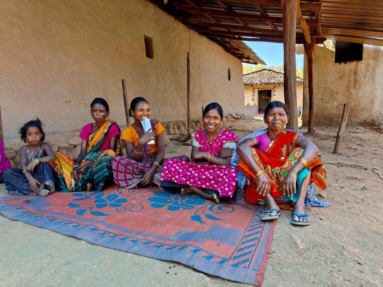 A group of women sitting at the v